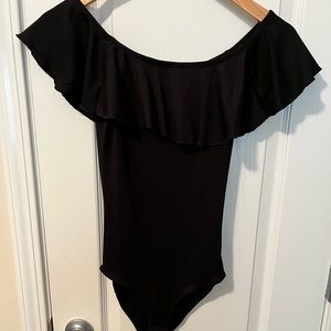 Black ruffle bodysuit. Size small. Worn once.